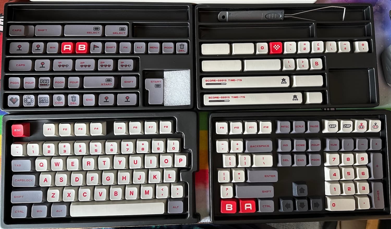 The 8BitDo keycaps in their trays